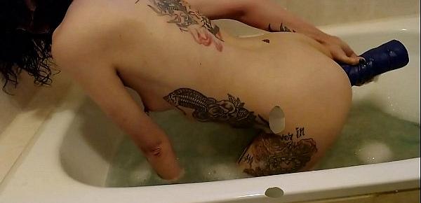  German slut takes a bath in her own piss, fucks huge dildos and gets a hard fistfuck
